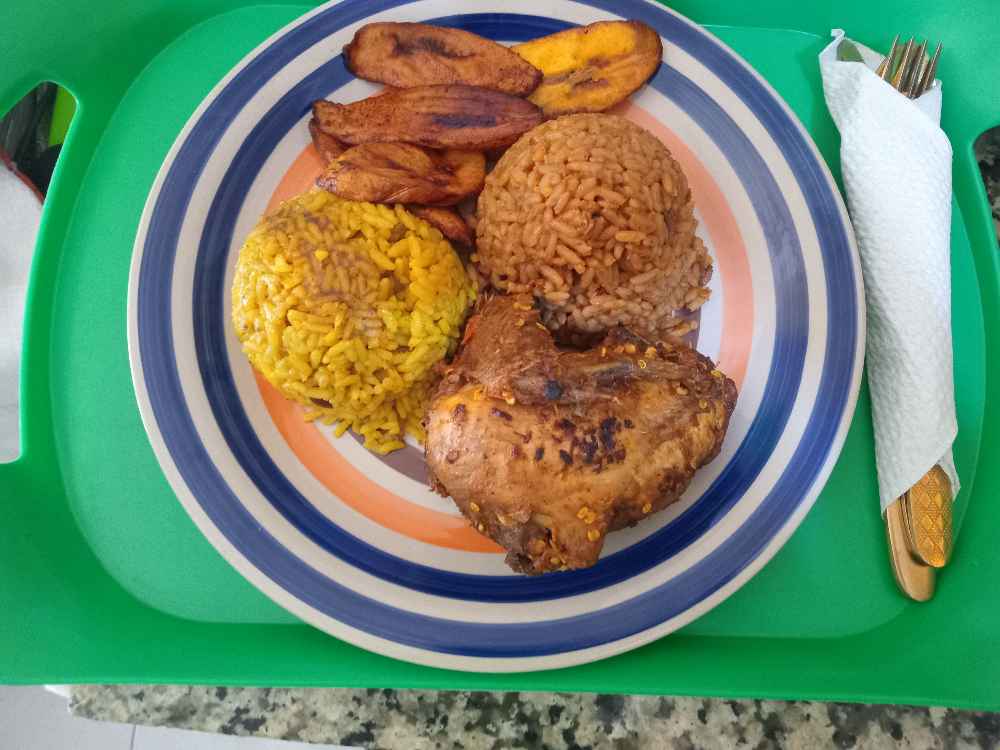 Fried Rice,Jellof Rice, quater part of chicken with plantains image - Mobi Foods